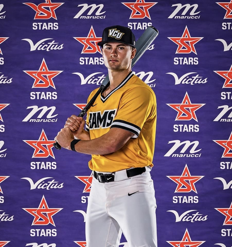 Confident athlete posing with baseball bat